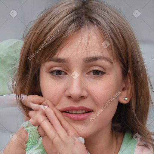 Joyful white young-adult female with medium  brown hair and grey eyes