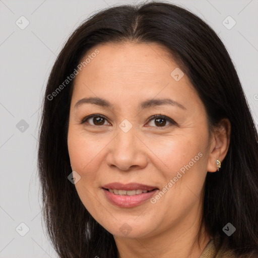 Joyful white adult female with long  brown hair and brown eyes