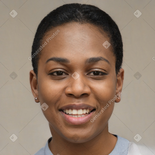 Joyful black young-adult female with short  black hair and brown eyes