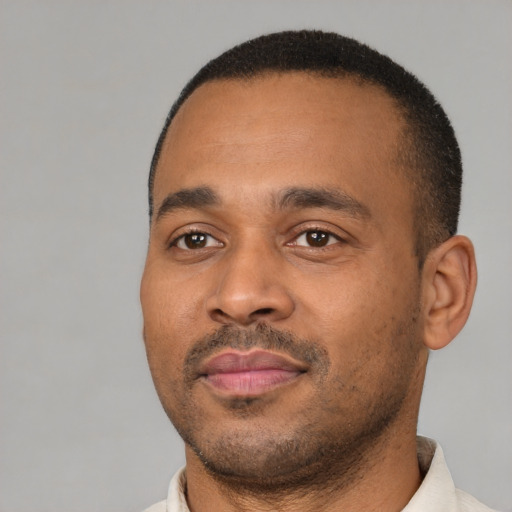Neutral latino adult male with short  black hair and brown eyes