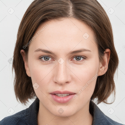 Joyful white young-adult female with medium  brown hair and grey eyes