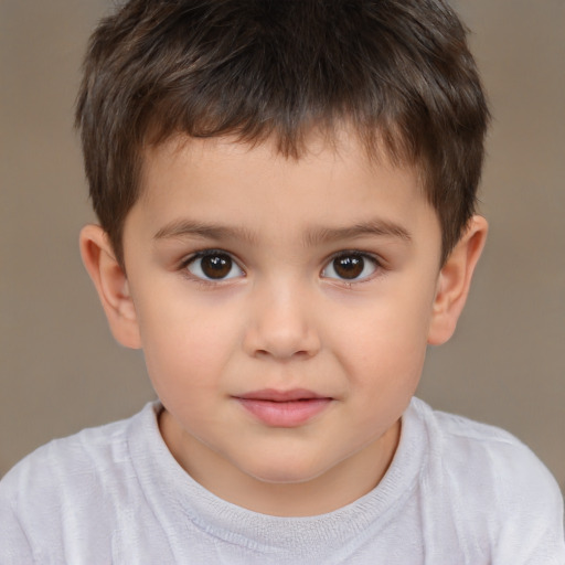 Joyful white child male with short  brown hair and brown eyes