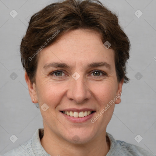 Joyful white adult female with short  brown hair and grey eyes