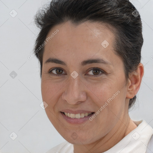 Joyful white adult female with short  brown hair and brown eyes