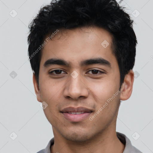 Joyful latino young-adult male with short  black hair and brown eyes