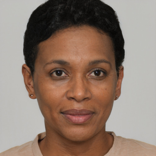 Joyful black adult female with short  black hair and brown eyes