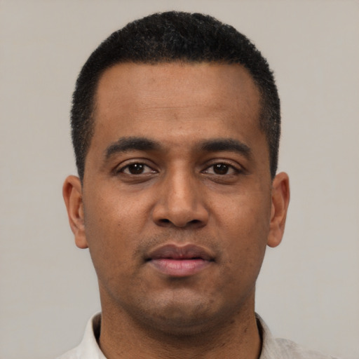 Neutral latino young-adult male with short  black hair and brown eyes