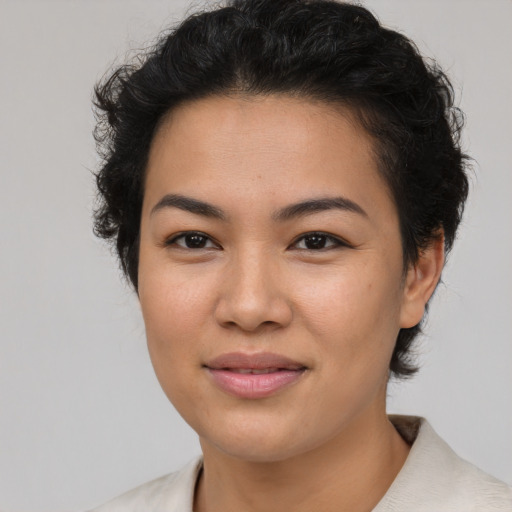 Joyful asian young-adult female with short  brown hair and brown eyes
