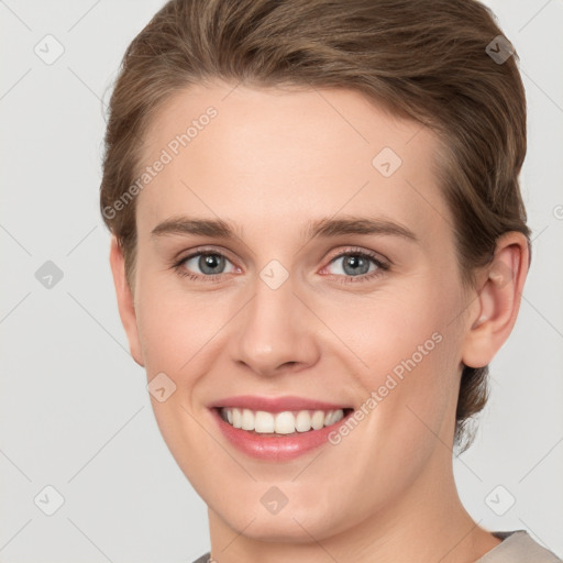 Joyful white young-adult female with short  brown hair and grey eyes