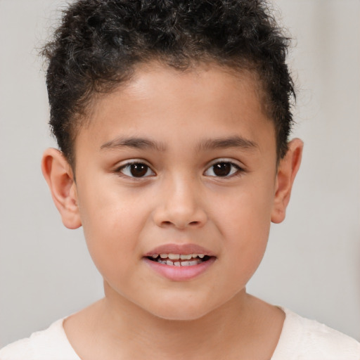 Joyful white child male with short  brown hair and brown eyes