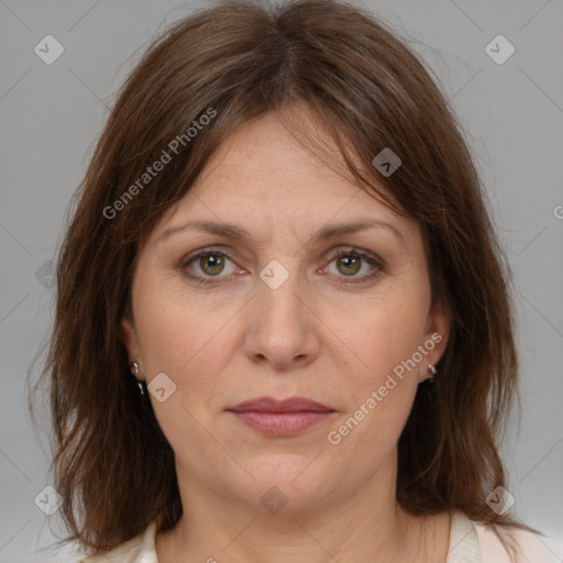 Joyful white adult female with medium  brown hair and brown eyes