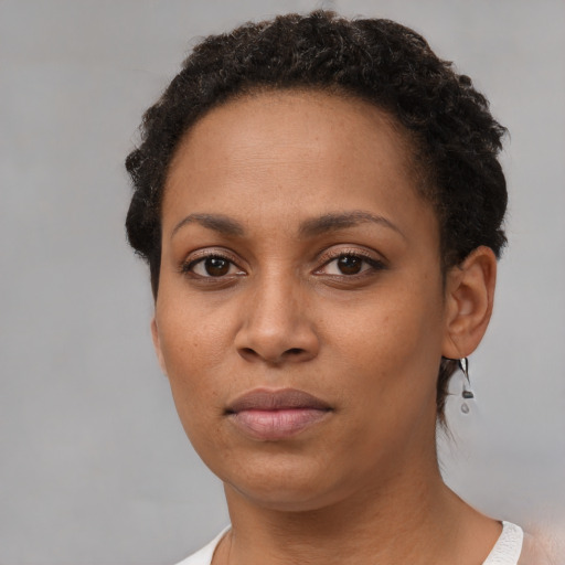 Neutral black young-adult female with short  brown hair and brown eyes