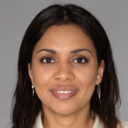 Joyful black young-adult female with medium  brown hair and brown eyes