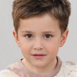 Joyful white child male with short  brown hair and brown eyes