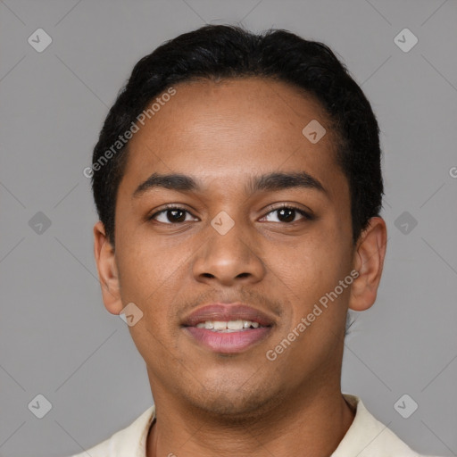Joyful latino young-adult male with short  black hair and brown eyes