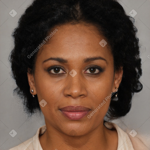 Joyful black adult female with short  brown hair and brown eyes