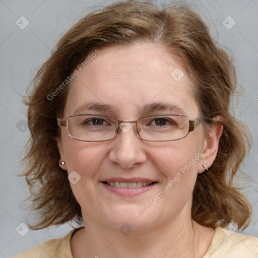 Joyful white adult female with medium  brown hair and blue eyes