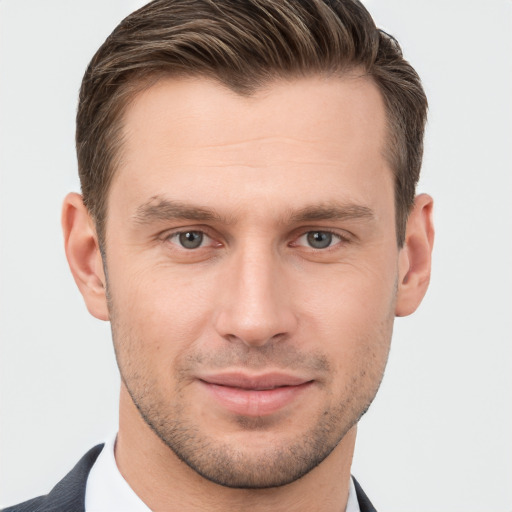 Joyful white young-adult male with short  brown hair and brown eyes