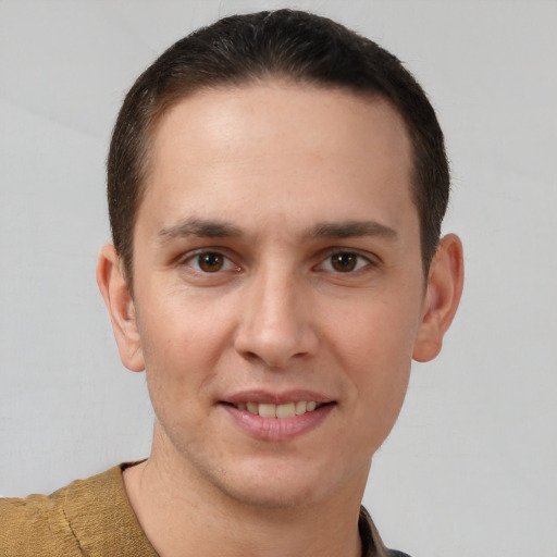 Joyful white young-adult male with short  brown hair and brown eyes