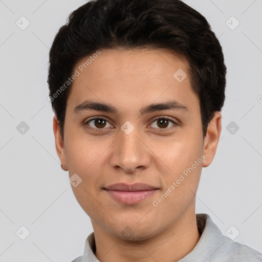 Joyful white young-adult male with short  black hair and brown eyes