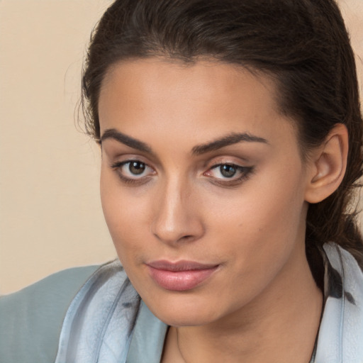 Neutral white young-adult female with medium  brown hair and brown eyes