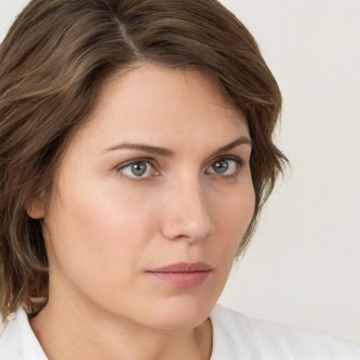 Neutral white young-adult female with medium  brown hair and green eyes