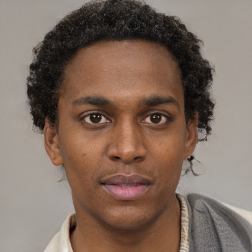 Neutral black young-adult male with short  brown hair and brown eyes
