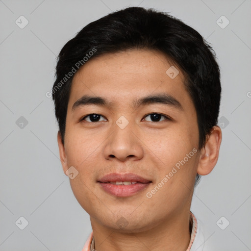 Joyful asian young-adult male with short  black hair and brown eyes