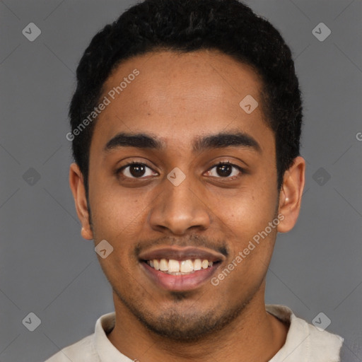 Joyful black young-adult male with short  black hair and brown eyes