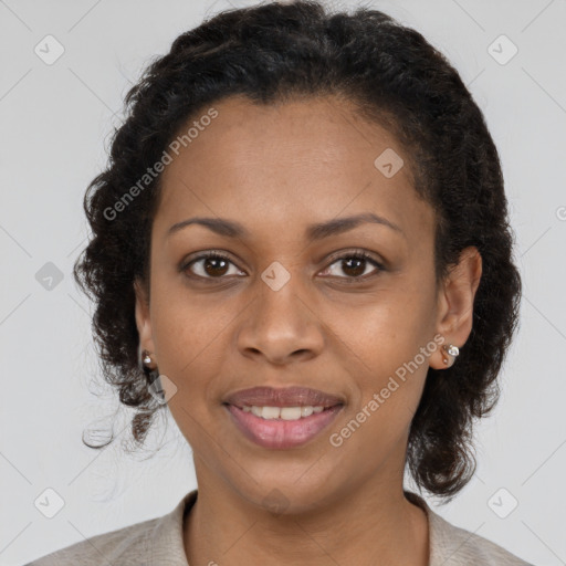 Joyful black young-adult female with medium  brown hair and brown eyes