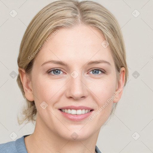 Joyful white young-adult female with medium  brown hair and blue eyes