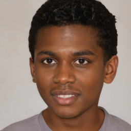 Joyful black young-adult male with short  brown hair and brown eyes