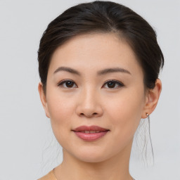 Joyful asian young-adult female with short  brown hair and brown eyes