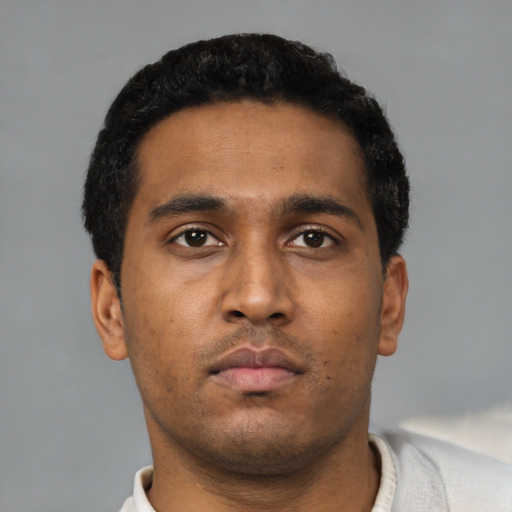 Neutral black young-adult male with short  black hair and brown eyes