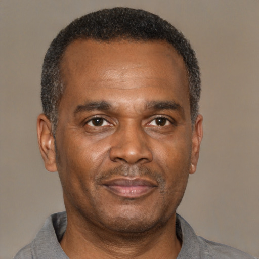Neutral latino adult male with short  black hair and brown eyes