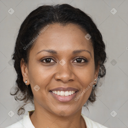 Joyful latino adult female with medium  brown hair and brown eyes