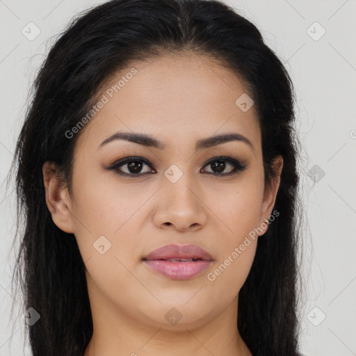 Joyful latino young-adult female with long  brown hair and brown eyes