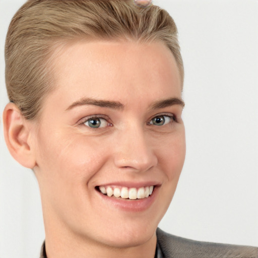 Joyful white young-adult female with short  brown hair and grey eyes