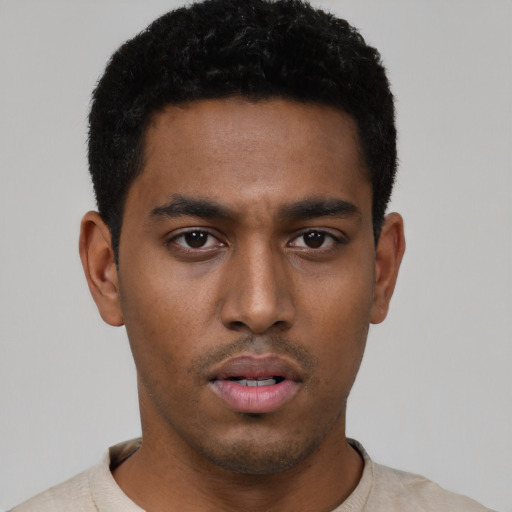 Neutral black young-adult male with short  black hair and brown eyes