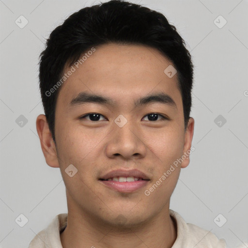 Joyful asian young-adult male with short  black hair and brown eyes