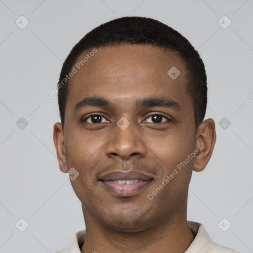 Joyful black young-adult male with short  black hair and brown eyes