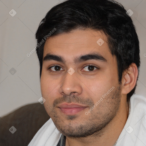 Joyful white young-adult male with short  black hair and brown eyes