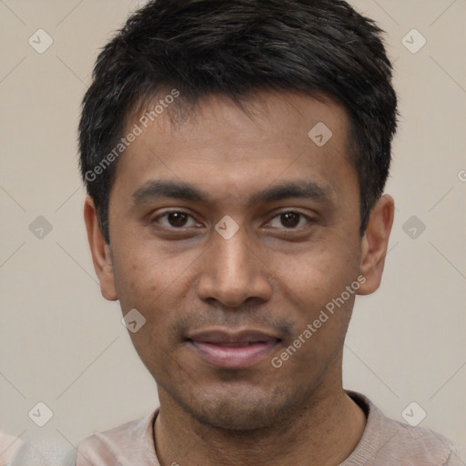 Joyful latino young-adult male with short  black hair and brown eyes