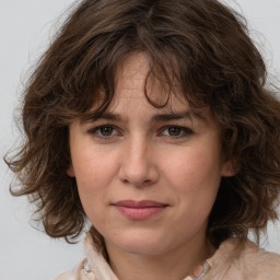 Joyful white adult female with medium  brown hair and brown eyes