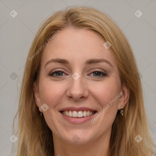 Joyful white adult female with long  brown hair and brown eyes