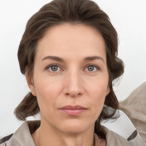 Neutral white adult female with medium  brown hair and grey eyes