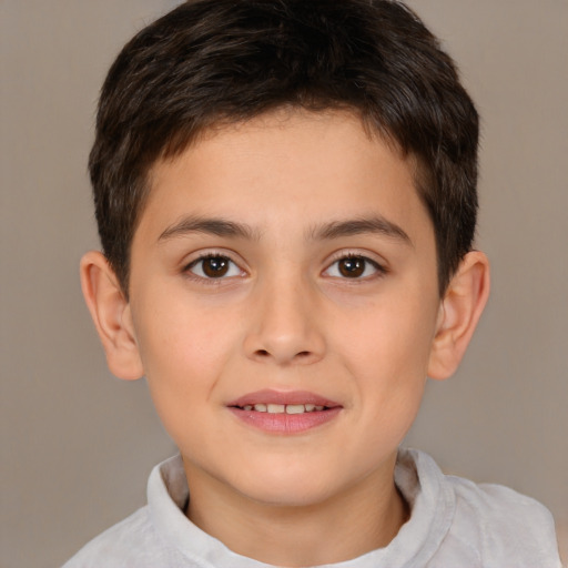 Joyful white child male with short  brown hair and brown eyes