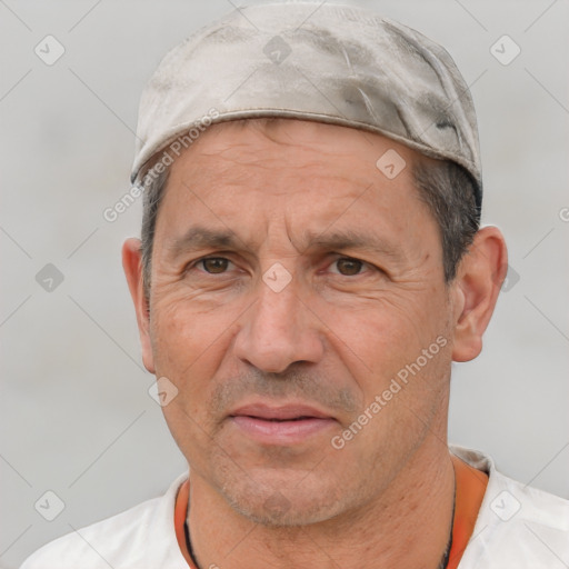 Joyful white middle-aged male with short  gray hair and brown eyes