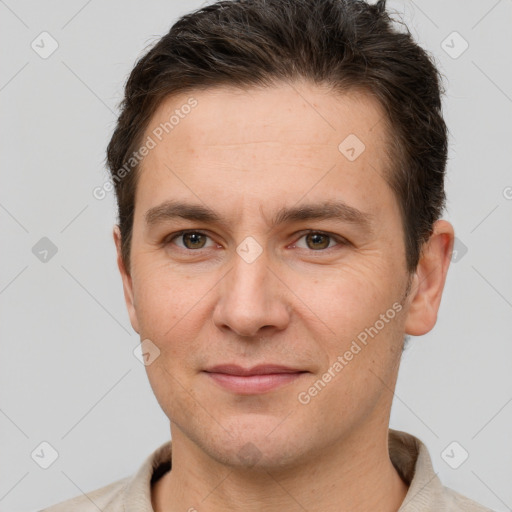 Joyful white adult male with short  brown hair and brown eyes