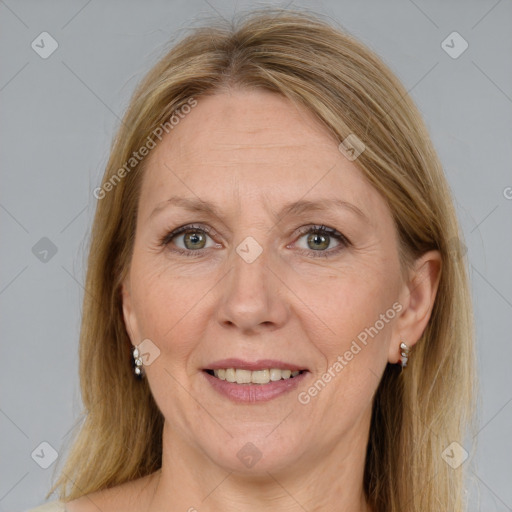 Joyful white adult female with medium  brown hair and grey eyes